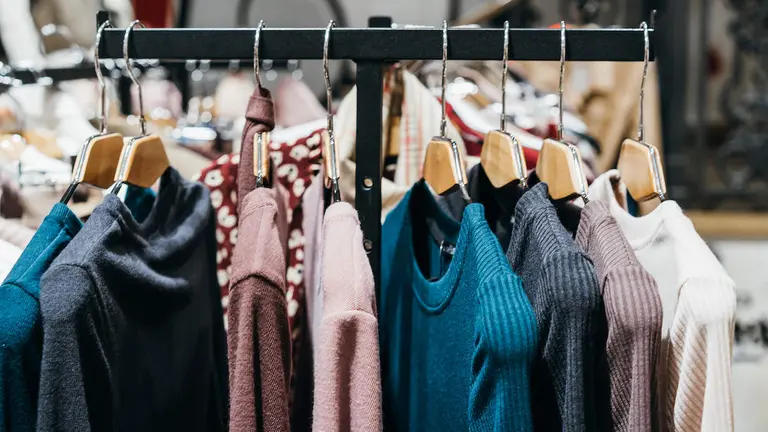 fashion clothing on hangers at the show